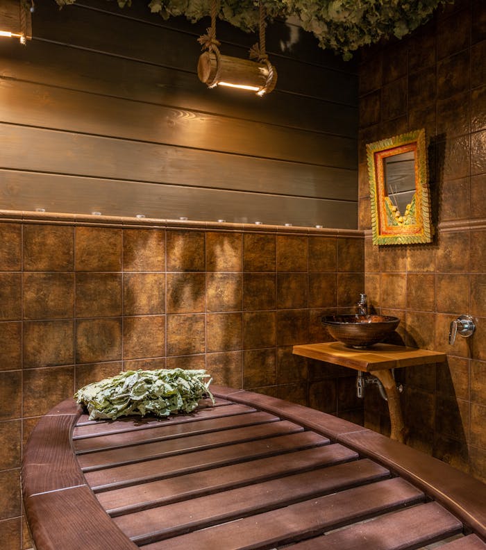 view-of-a-brown-room-7598363 Luxurious spa room featuring wooden elements and ambient lighting, ideal for relaxation and rejuvenation.
